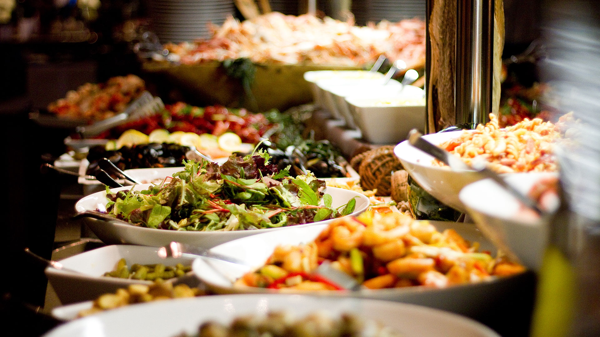 Buffet with salad, seafood, and various dishes at the restaurant
